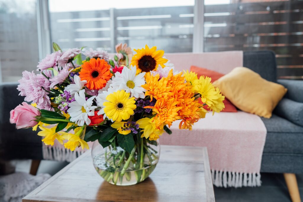 Vase With Huge Multicolor Various Mixed Flower Bouquet On The Co