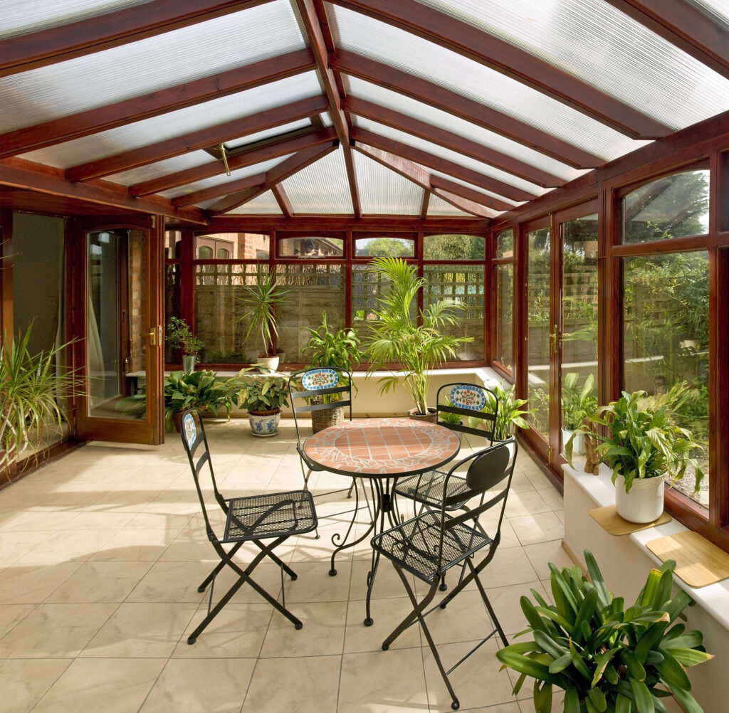 Victorian style conservatory - conservatory tables chairs plants room