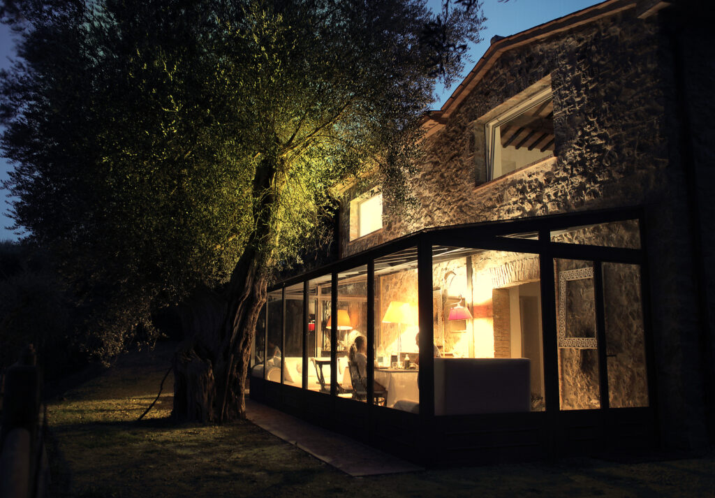 hardwood orangery - house with sun porch at night