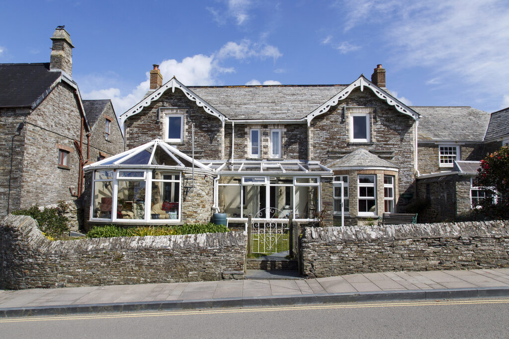 traditional conservatories - house with two added conservatories